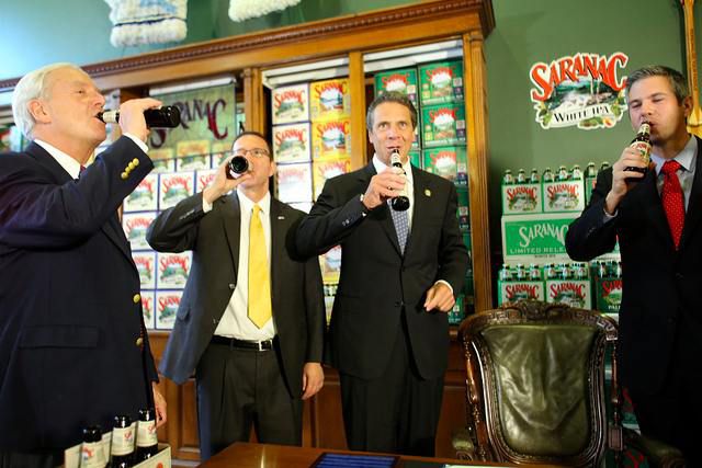 Governor Cuomo takes a sip of beer earlier this summer